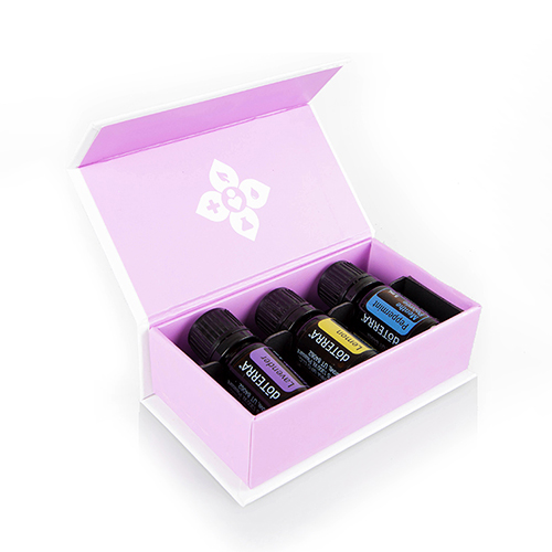 Pink box with a bottle of Lavender, Lemon, and Peppermint oil inside.