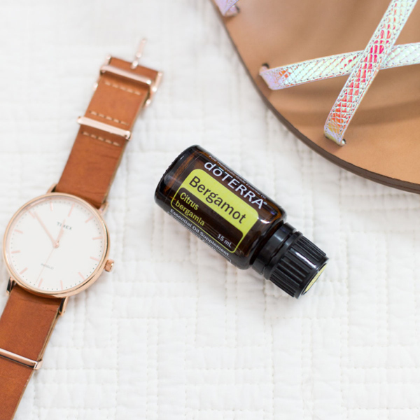 Bottle of doTERRA Bergamot oil, wristwatch, and sandal. What are the health benefits of bergamot oil? Bergamot essential oil has many benefits, including uplifting mood, calming the senses, improving the appearance of skin, and more.