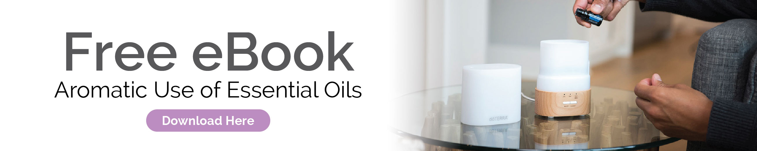 Person placing oil drops into essential oil diffuser. Get a free eBook, Aromatic Use of Essential Oils. Click here to download.