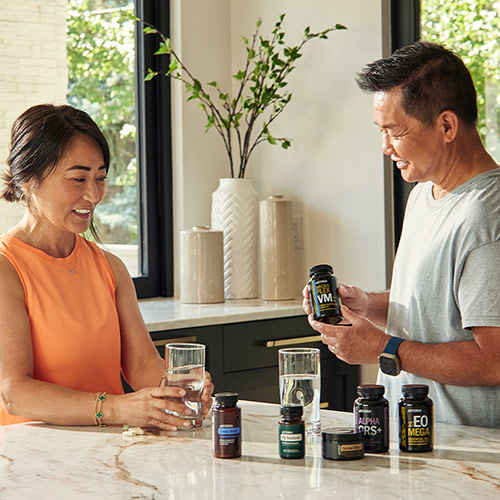 two people taking doTERRA supplements