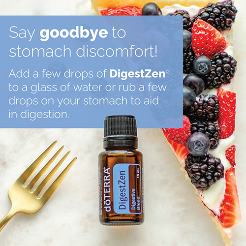 doTERRA DigestZen placed upward on a counter surface. A gold fork and a fruit and yogurt pastry sitting on either side. Text is included above the essential oil bottle.