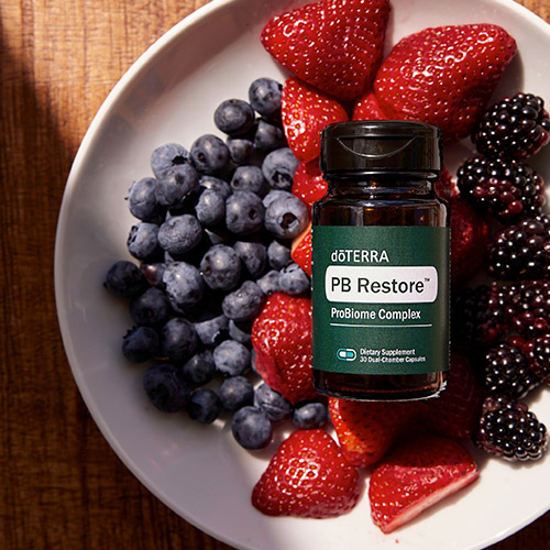 PB Restore in a bowl full of berries