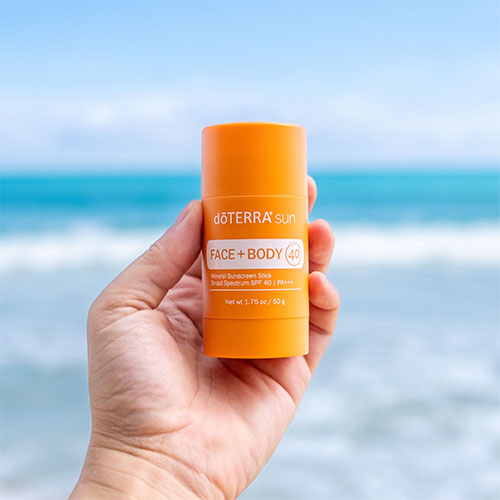 Hand holding sunscreen