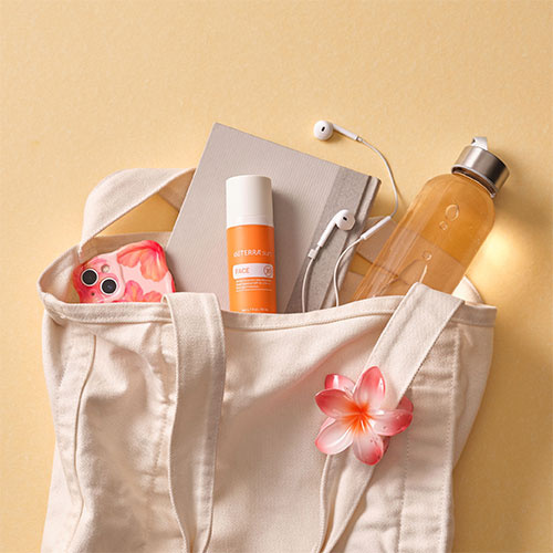 doTERRA sunscreen in a beach bag