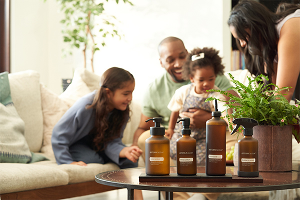 doTERRA Abode Line over a table with a family in the background