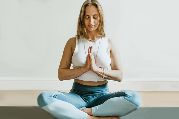 Woman in a lotus yoga position