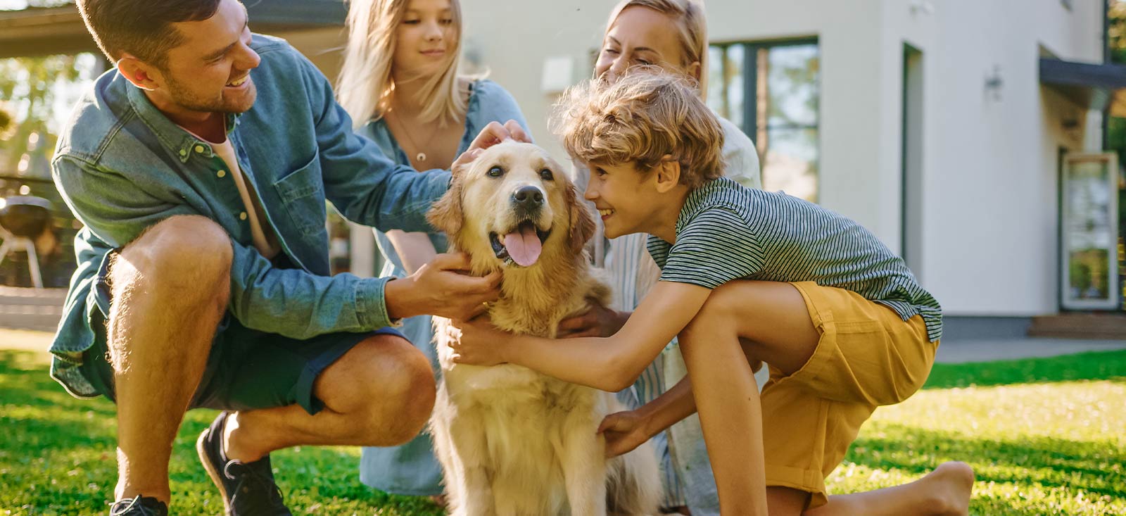 Family petting a dog