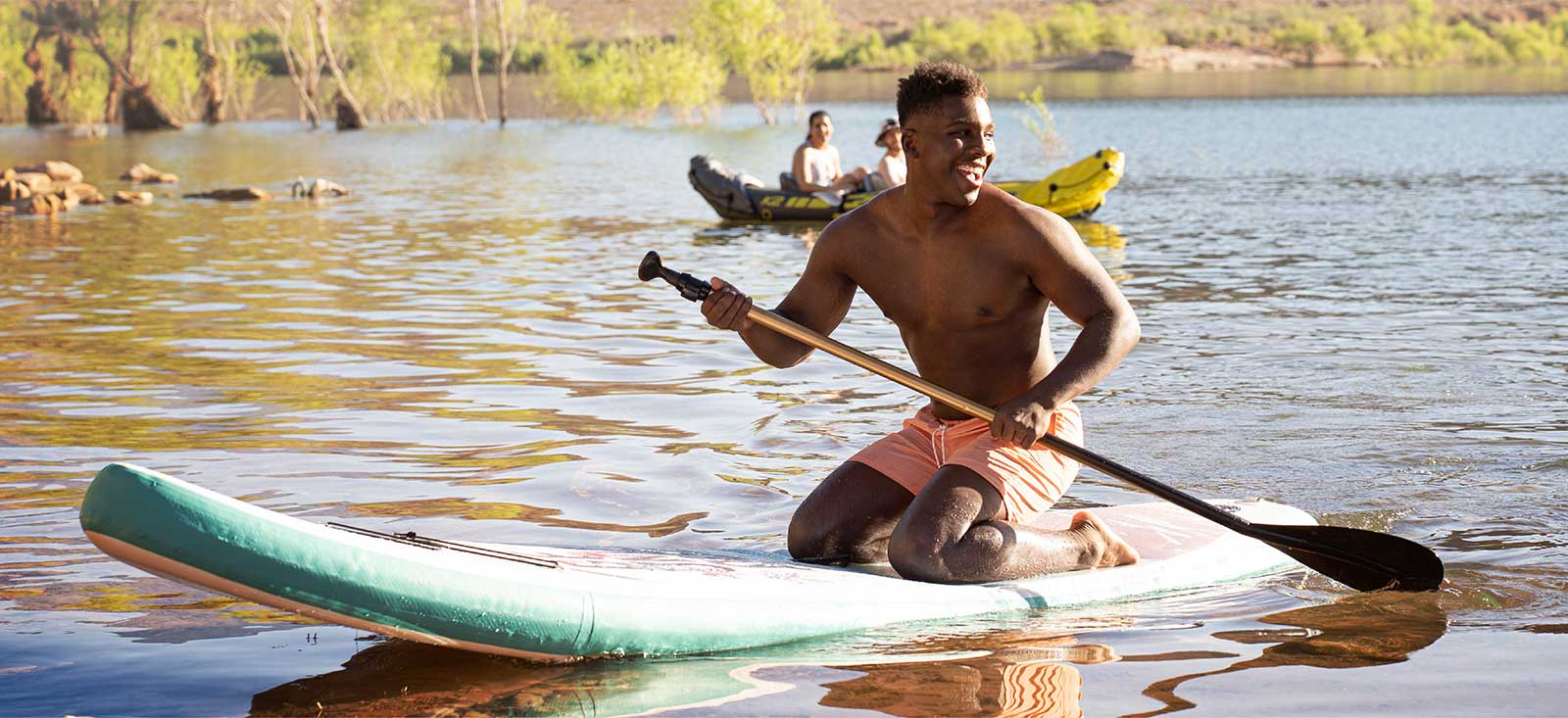 Young man on a paddle board