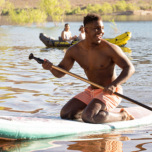 Young man on a paddle board