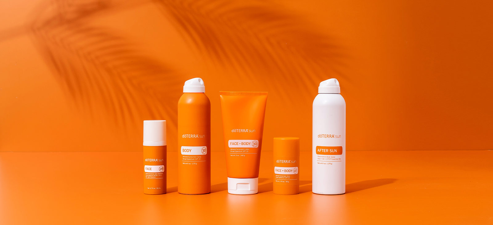 doTERRA sun line products on an orange background