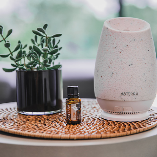 Roam Diffuser with Hygge Essential Oil on a table