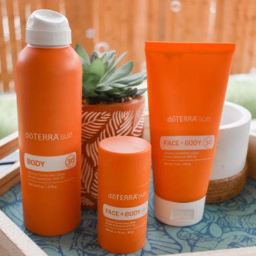 doTERRA sun Products on a tray with some plants