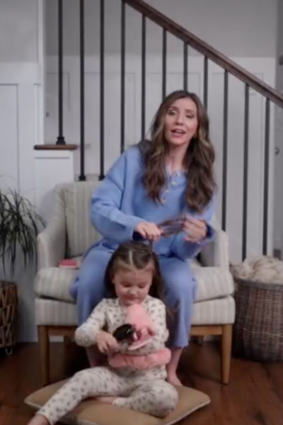 A woman playing with her child