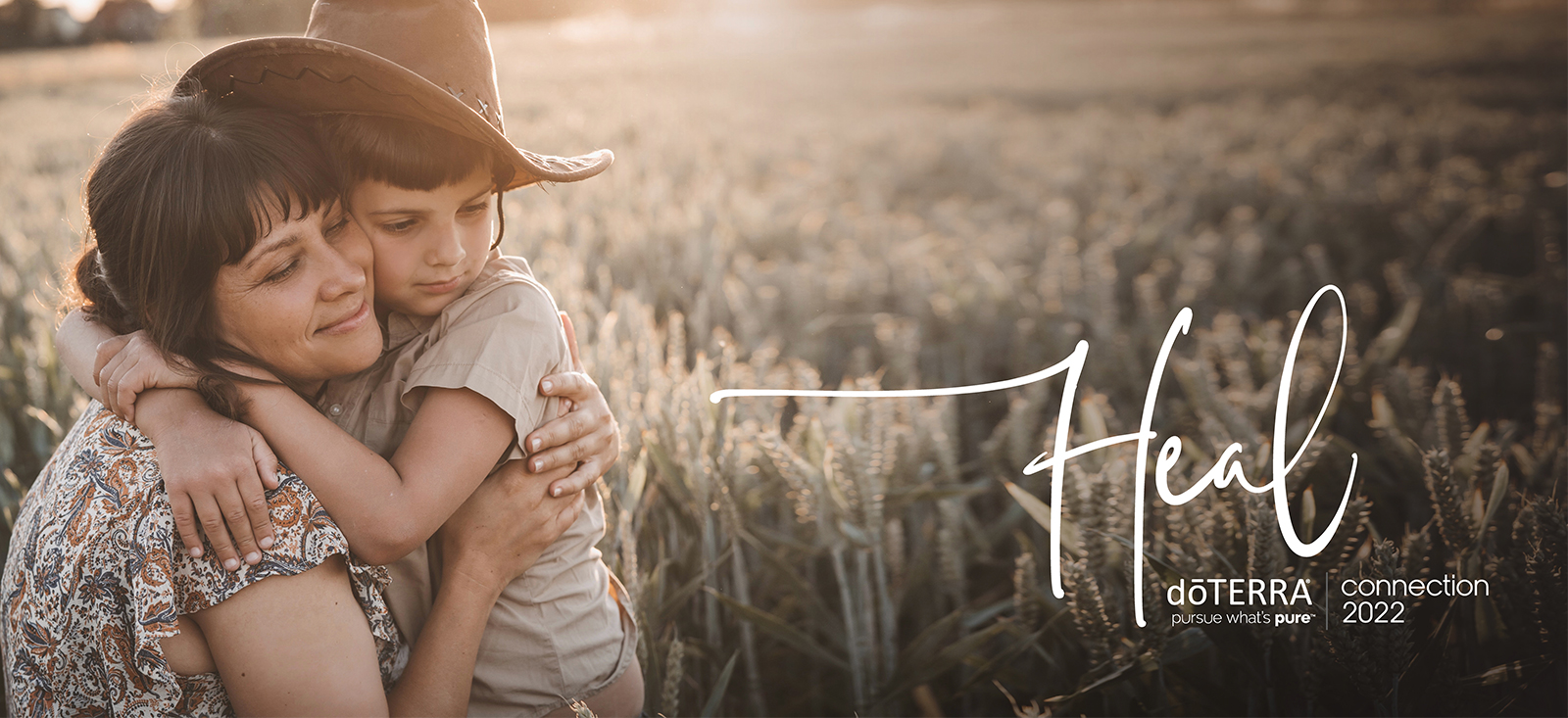 Woman holding her son at a field