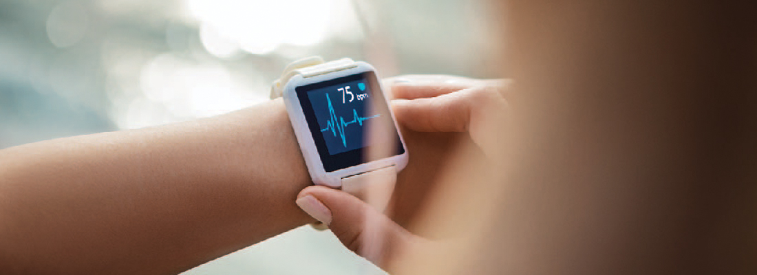 A person looking at their smartwatch heart monitor