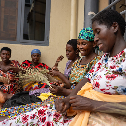 Women sitting in a circle laughing