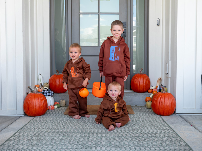 Children in sweaters that have doTERRA essential oil labels