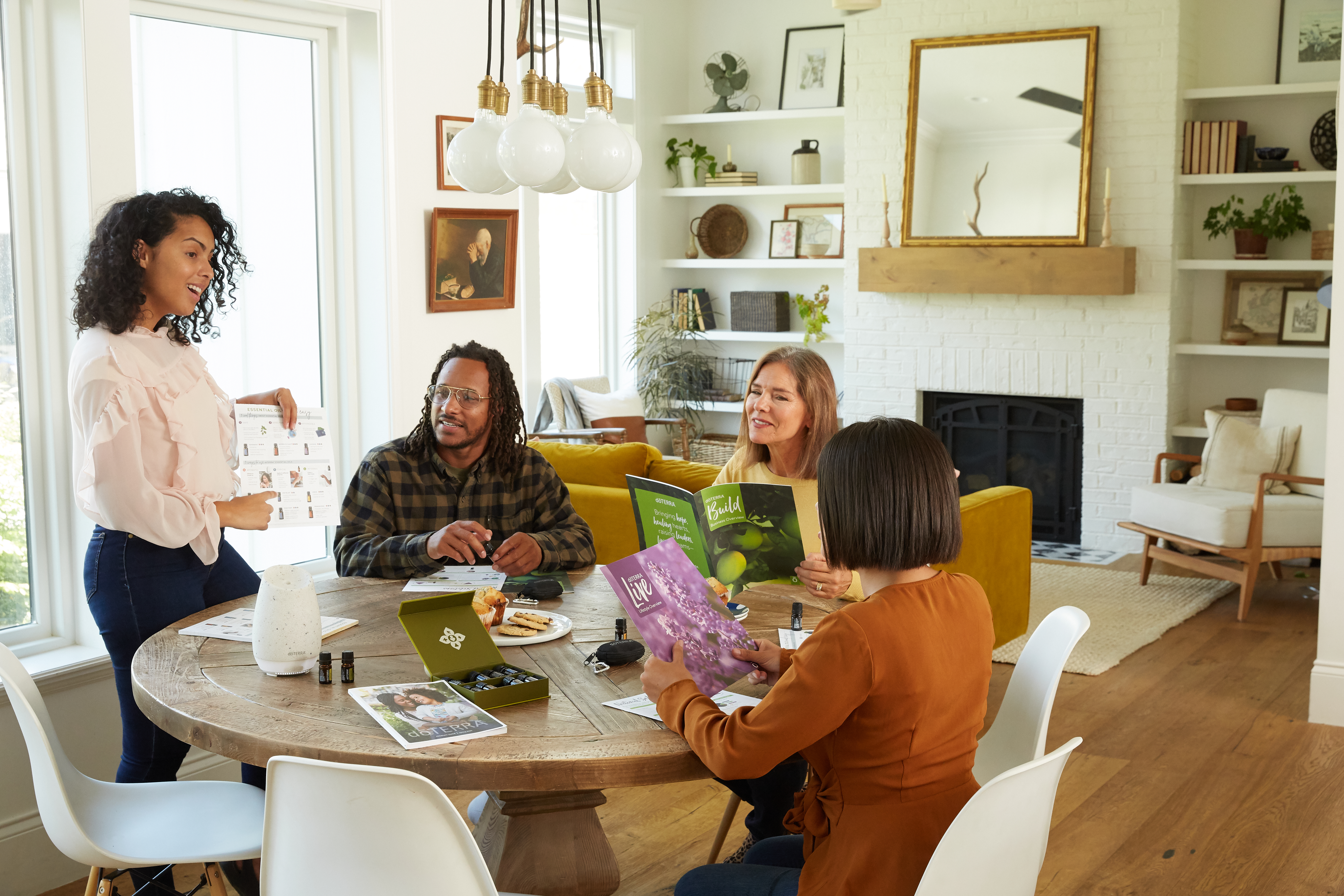 A group of people sitting around a table in a living room