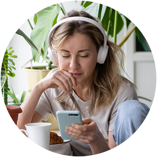Woman listening to podcast with headphones on
