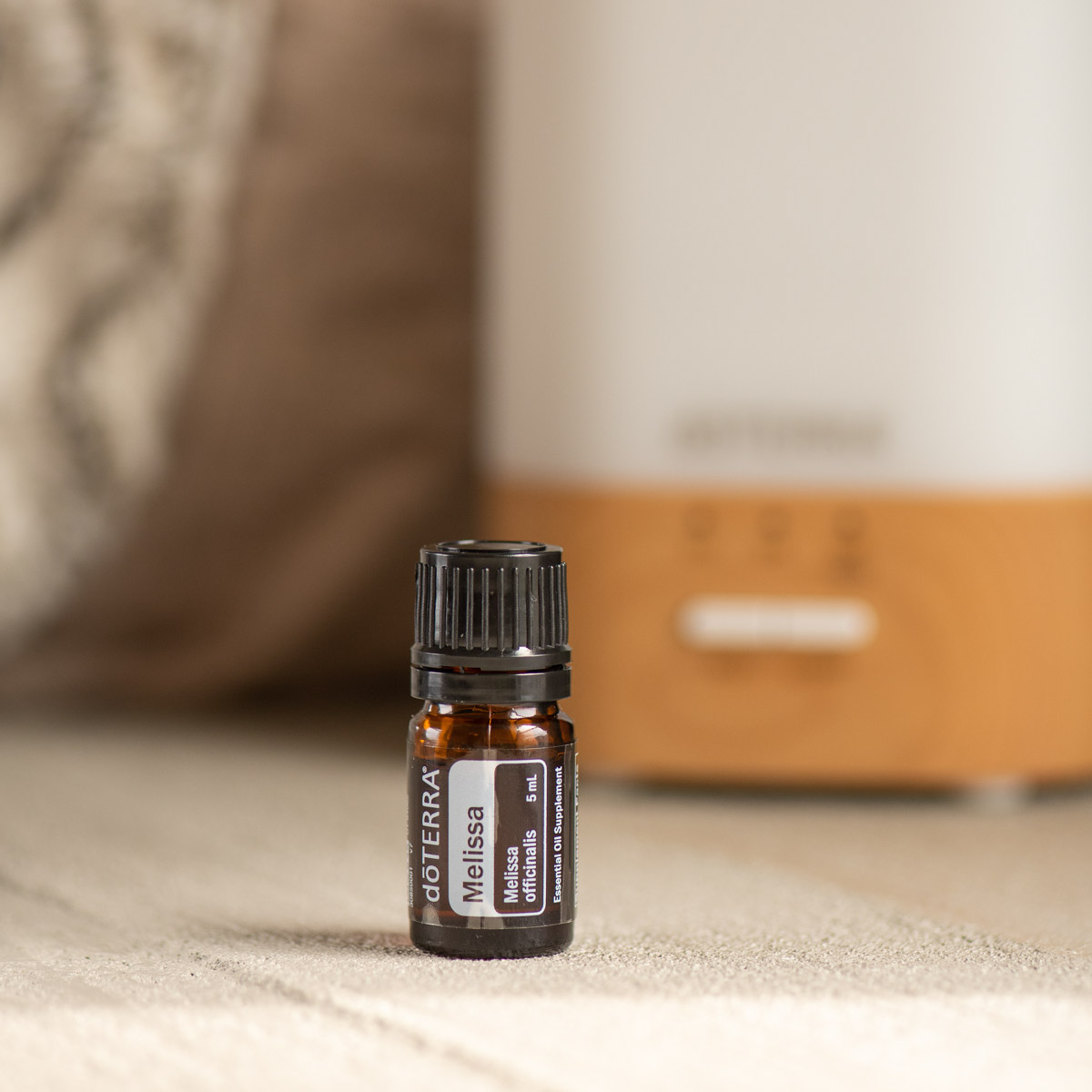 : Bottle of Melissa oil next to doTERRA diffuser. What does Melissa oil smell like? Melissa essential oil has a sweet, fresh, citrus-like fragrance.