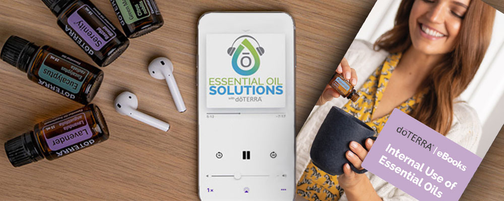 Essential oils bottles, cell phone, and AirPods on a table