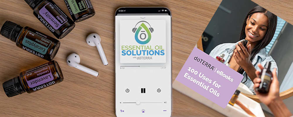 Essential oils bottles, cell phone, and airpods on a table